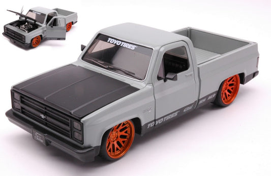CHEVROLET C-10 PICK UP 1985 "TOYO TIRES" GREY/BLACK 1:24 - Jada Toys - JADA33610