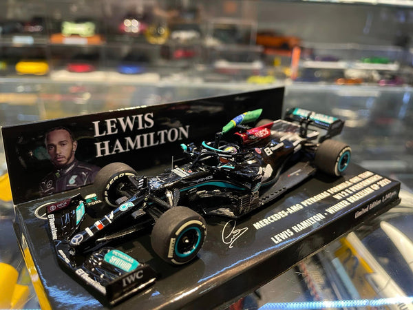 Mercedes AMG W12 (2021) 1:43 - L. Hamilton - 1st Brazilian GP - With Flag - Minichamps